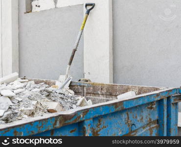 Full construction waste debris container, garbage bricks and material from demolished house