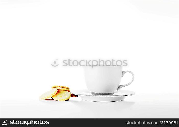 full cup of tea and pastry