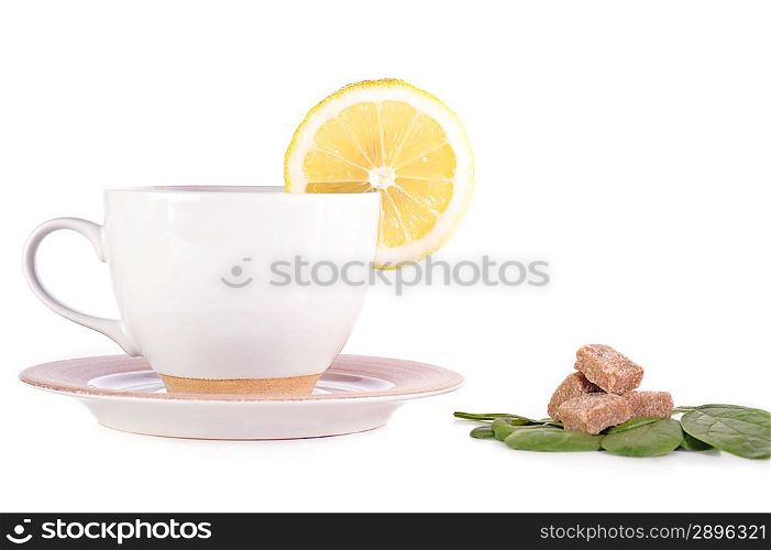 full cup of tea with lemon and sugar