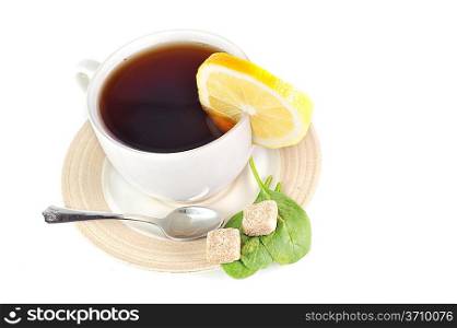 full cup of tea with lemon and sugar