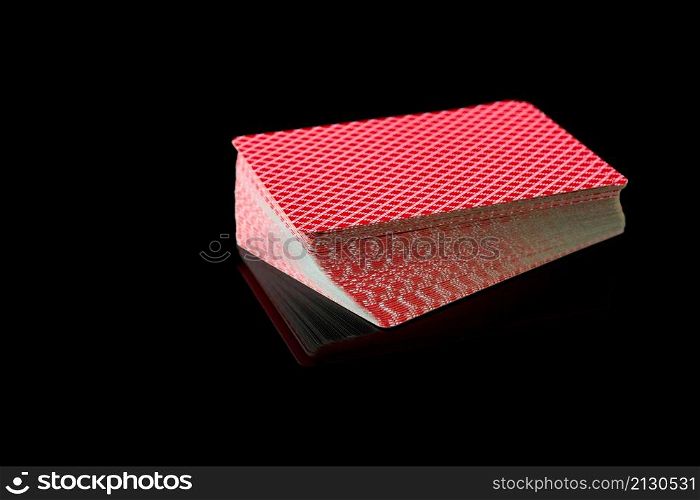 Full deck of playing cards on dark reflective background.. Full deck of playing cards on dark reflective background