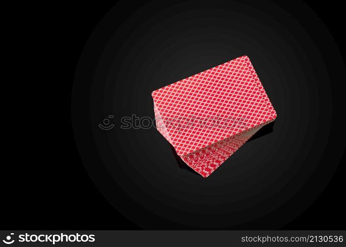 Full deck of playing cards on dark reflective background.. Full deck of playing cards on dark reflective background