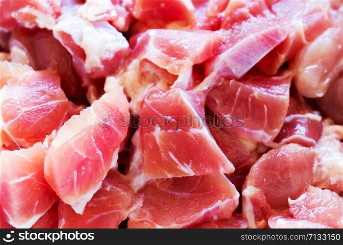 Full frame picture of fresh pork cut into pieces.