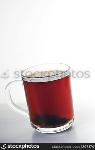 Full glass cup of tea isolated