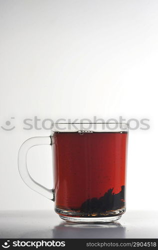 Full glass cup of tea isolated