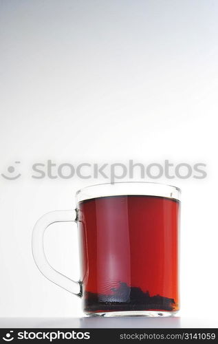 Full glass cup of tea isolated