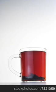 Full glass cup of tea isolated