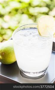 Full glass of fresh cool soda with lime