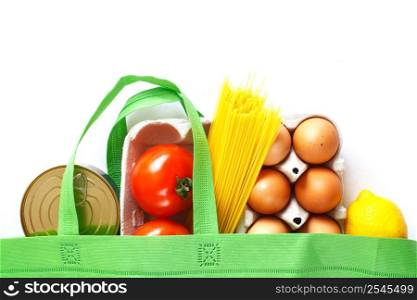 Full green bag of healthy food on a white background. Top view. fruit, vegetable, eggs online shop. your text. food delivery. Full green bag of healthy products food on a white background. Top view. online shop. your text. food delivery