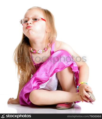 Full lehgth a cute girl sitting on floor puffs up her cheeks on white background