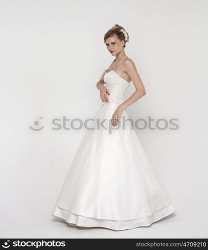 Full length of bride wearing luxurious wedding dress