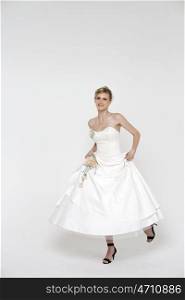Full length of bride wearing luxurious wedding dress