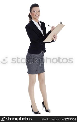 Full length of business woman writing in pad over white background