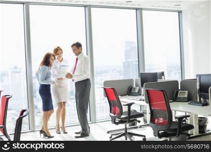 Full length of businesspeople discussing in office