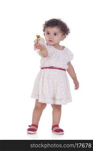 Full length of cute girl holding toy against white background