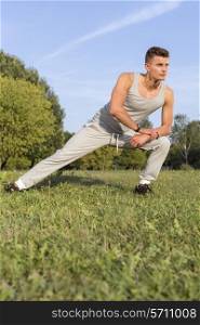 Full length of determined man exercising in park
