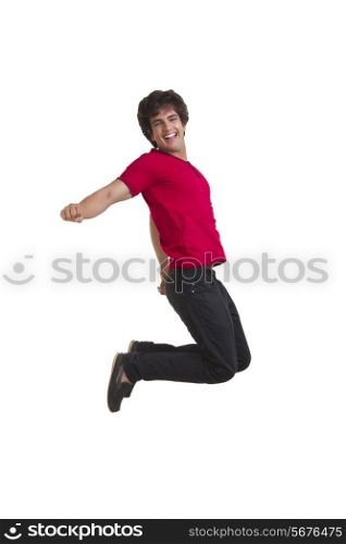 Full length of excited young man jumping isolated over white background