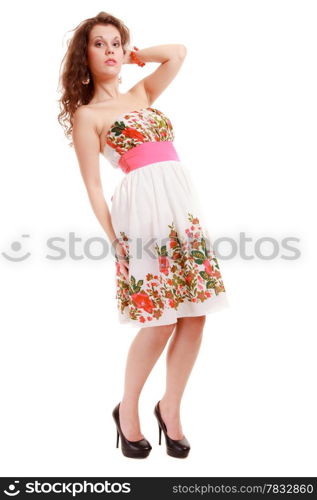 Full length of fashionable young woman. Girl in summer floral dress isolated. Fashion. Studio shot.