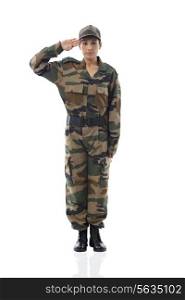 Full length of female soldier saluting