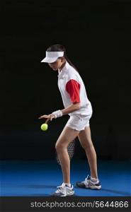 Full length of female tennis player preparing to serve at court