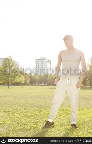 Full length of fit man standing in park