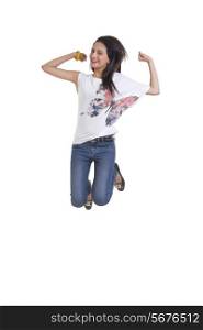 Full length of happy young woman jumping isolated over white background