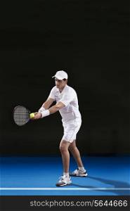 Full length of male tennis player preparing to serve at court