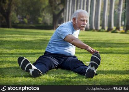 Full length of man exercising in park