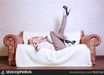 Full length of modern businesswoman young woman or student girl with headphones listening to music mp3 relaxing or learning language. Indoor.