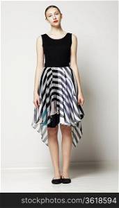 Full Length of Modish Woman in Strippy Dress. Springtime Workday Collection