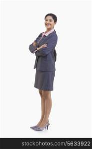 Full length of portrait young businesswoman in suit isolated over white background