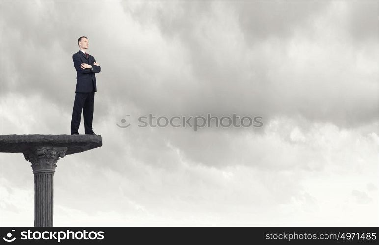 Full length of thoughtful businessman looking away. Pensive businessman