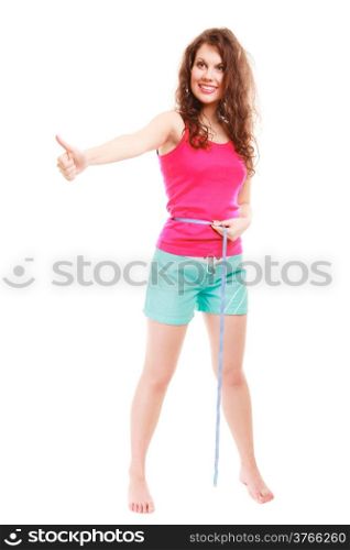 Full length of weight loss young sport fitness woman with measure tape. Happy girl showing thumb up success hand sign isolated. Diet and nutrition. Studio shot.