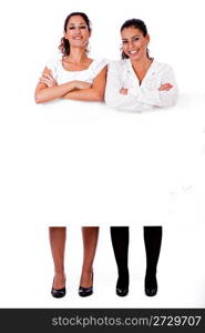 full length of young business women&rsquo;s with their hands folded on isolated white background