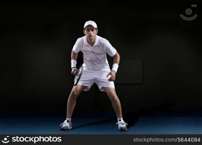 Full length of young man holding tennis racket at court