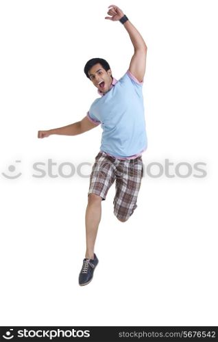 Full length of young man jumping isolated over white background