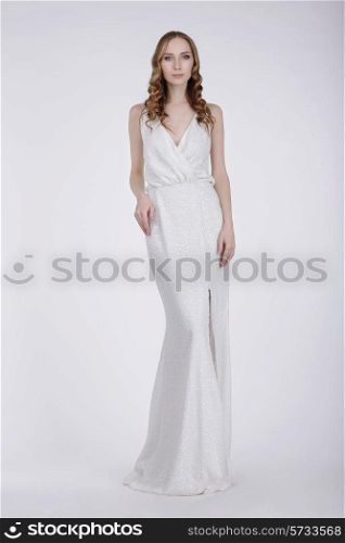 Full Length of Young Woman in White Evening Dress