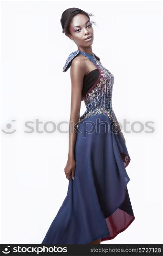 Full-length photo of beautiful black woman in a blue creative dress