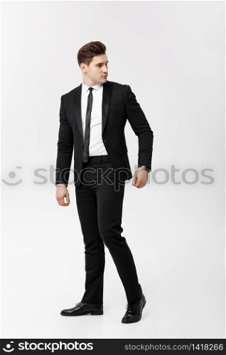 Full length Portrait Businessman posing stylishly on white background. Full length Portrait Businessman posing stylishly on white background.