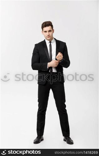 Full length Portrait Businessman posing stylishly on white background. Full length Portrait Businessman posing stylishly on white background.