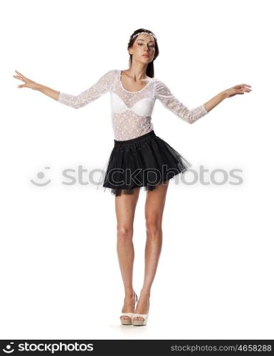 Full length portrait of a beautiful slim brunette model in black skirt and white blouse transparent, on white isolated background