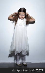 full-length portrait of a little girl in the studio