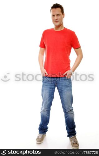 Full length portrait of a young man with hands in pockets , isolated on white background