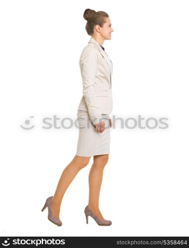 Full length portrait of business woman going sideways