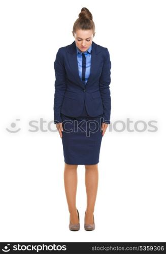 Full length portrait of business woman making asian greeting