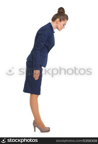 Full length portrait of business woman making asian greeting