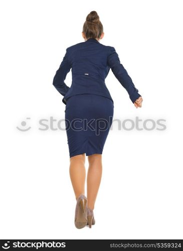 Full length portrait of business woman running straight . rear view