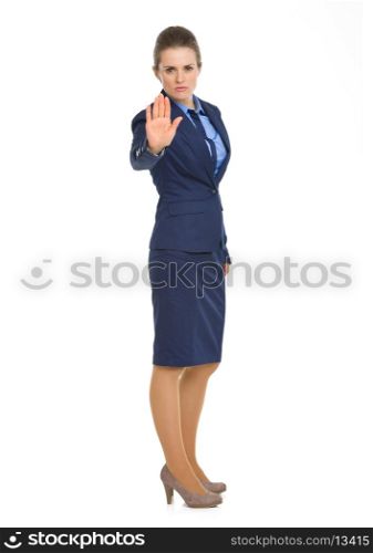 Full length portrait of business woman showing stop gesture