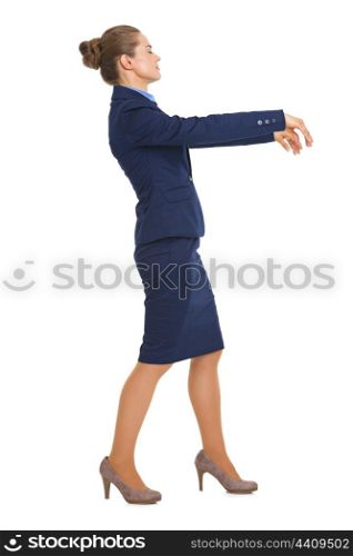 Full length portrait of business woman walking like zombie