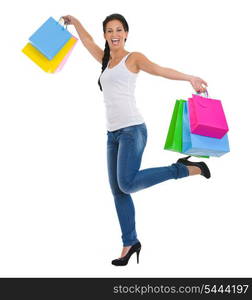 Full length portrait of cheerful girl with shopping bags